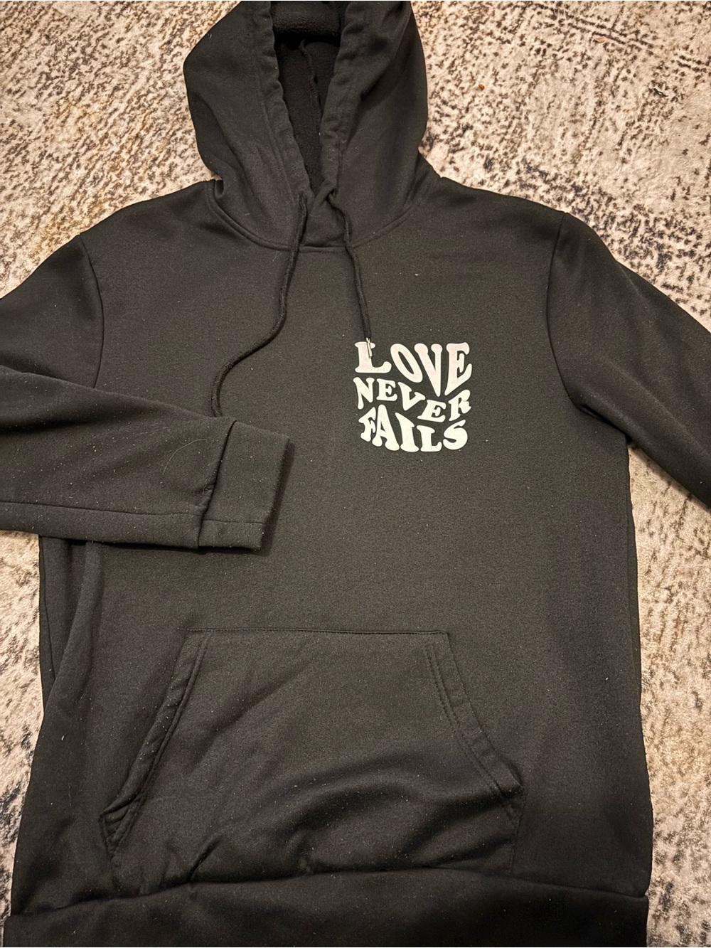Black "Love Never Fails" Graphic Hoodie - Men
